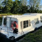 Vedette fluviale Jeanneau Eau Claire 930 Cassis (1985) – vue arrière bâbord depuis la berge