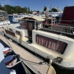 Pénichette Locaboat 930 Sérénité (1981) – vue arrière depuis le ponton, terrasse et timonerie