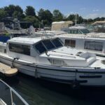 Vedette fluviale Connoisseur 1135 Ingrine (1986) – vue extérieure tribord à quai