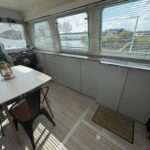 Vedette hollandaise Vetus 1200 Damier (1992) – carré avec rangements et fenêtres à stores